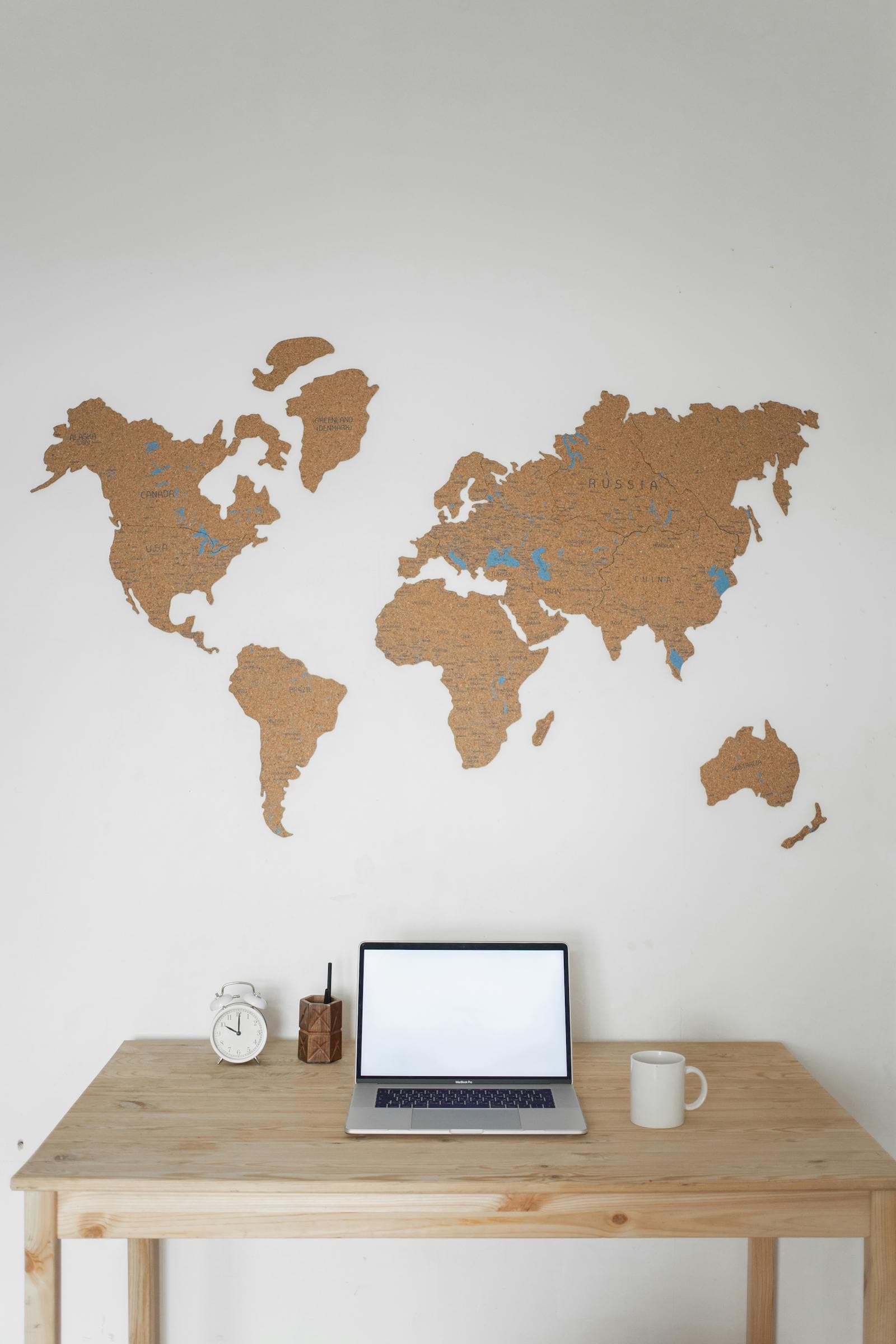 A world map above a desk representing multi-state operations